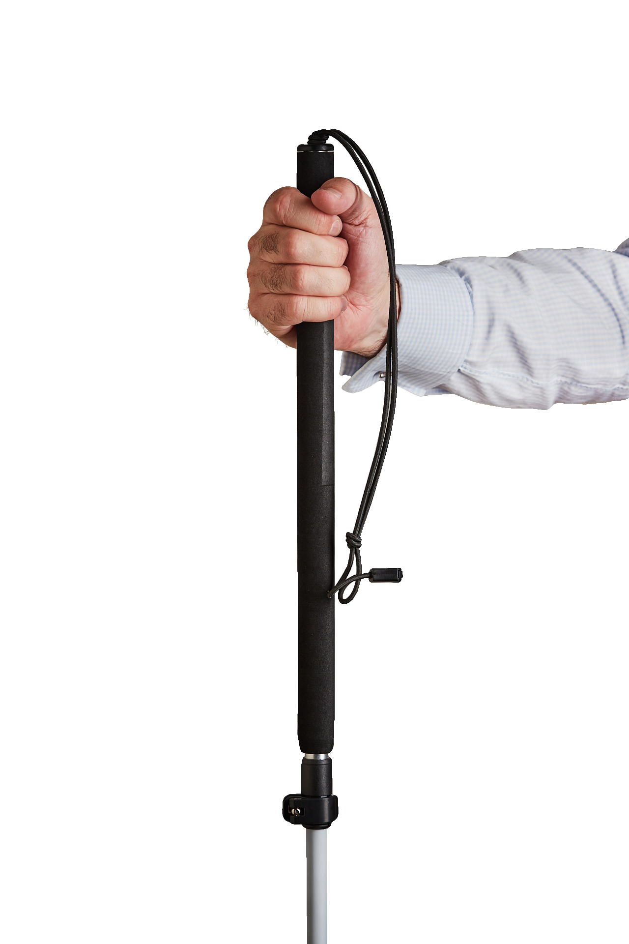 A hand holding the handle of a black cane with a white stripe. The cane has a red roller ball tip and a wrist strap.