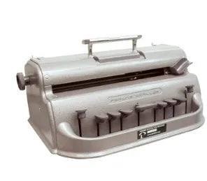 A gray, mechanical braille writer with a handle, keyboard, and paper feed. It is used for writing braille text and is manufactured by Floridareading.