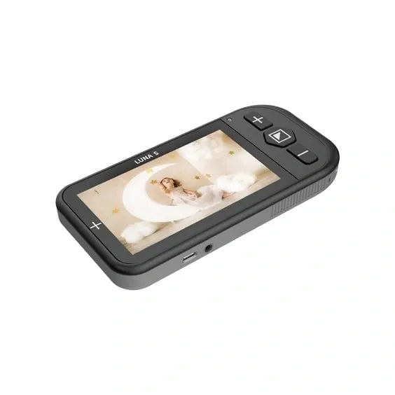 Floridareading Luna S: A small, handheld device with a screen displaying an image of a baby sleeping. It has buttons on the side and is used for magnifying objects for people with low vision.