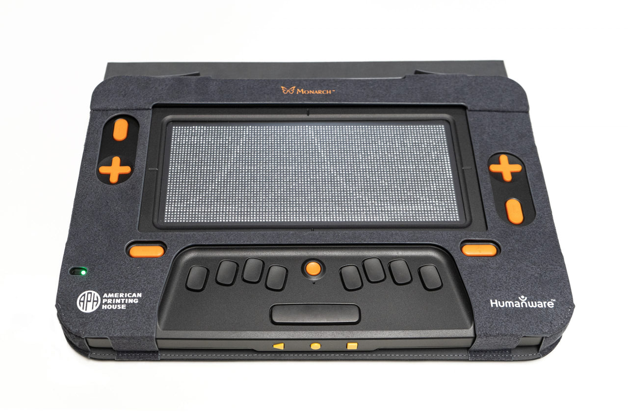 Monarch Braille Tablet with a tactile display and orange navigation buttons for enhanced accessibility.