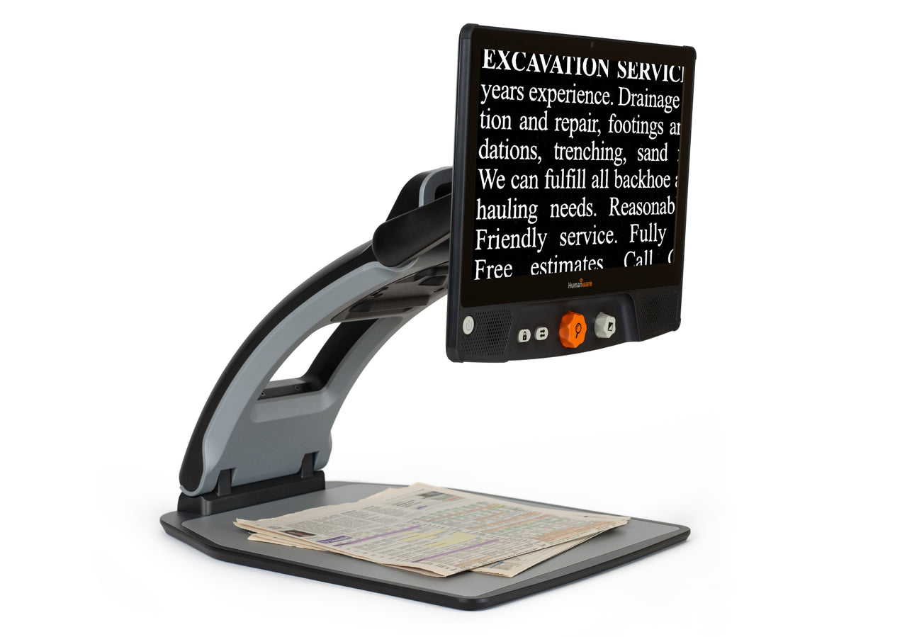 A Reveal Magnifier displaying text from a newspaper, making it easier to read for people with visual impairments.